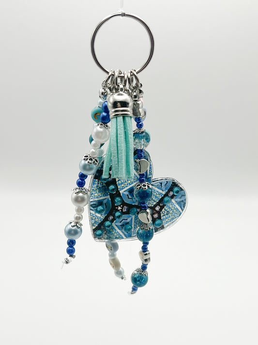 alt="Bijou de sac Vision O'Shiny Art & Lifestyle, motif sublimé œuvre originale, perles et strass posés à la main, série limitée numérotée" version attache simple argenté