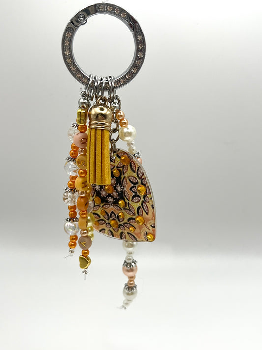 alt="Bijou de sac Ensoleillement O'Shiny Art & Lifestyle, motif sublimé œuvre originale, perles et strass posés à la main, série ultra limitée numérotée"