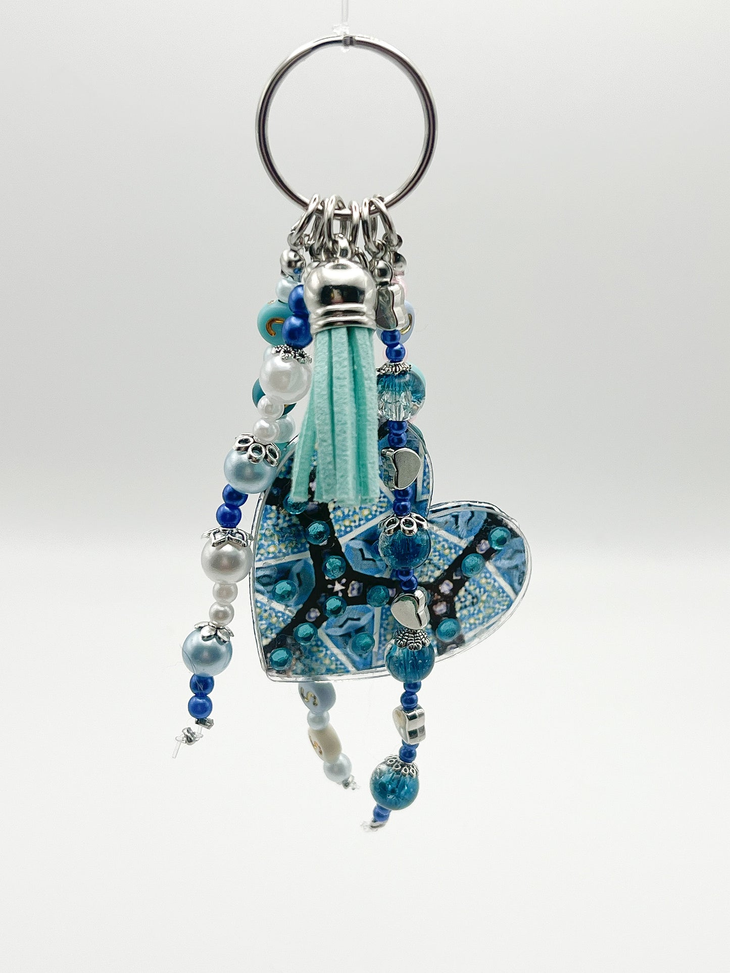 alt="Bijou de sac Vision O'Shiny Art & Lifestyle, motif sublimé œuvre originale, perles et strass posés à la main, série limitée numérotée" version attache simple argenté